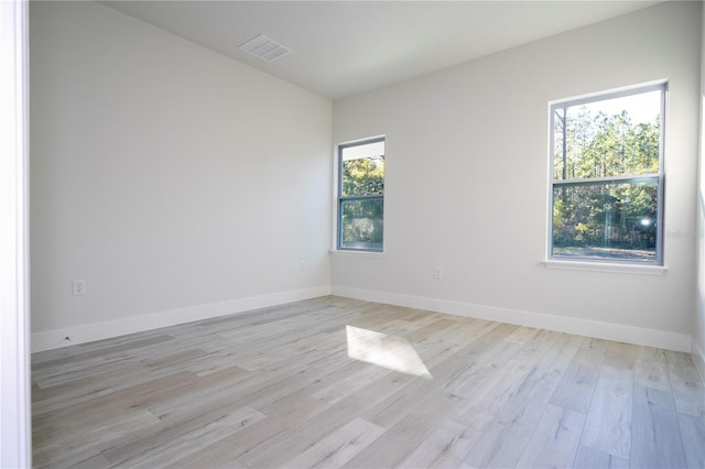 spare room with light wood-type flooring