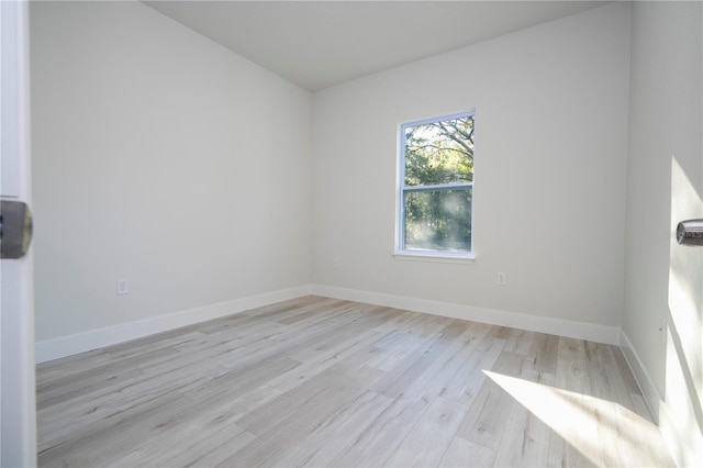 empty room with light hardwood / wood-style floors