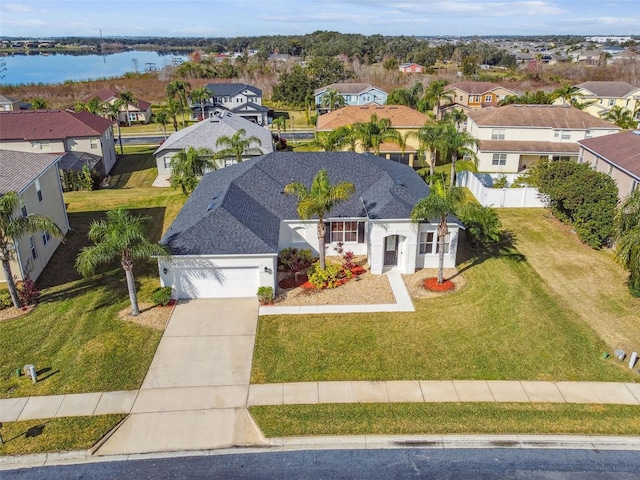 birds eye view of property with a water view