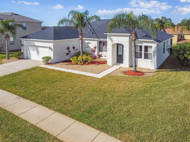 view of front of home featuring a garage and a front yard