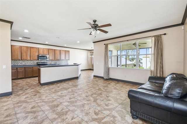 living room featuring crown molding and ceiling fan