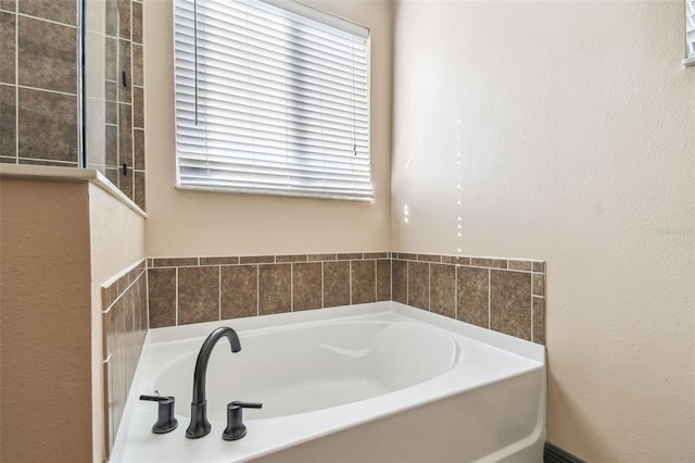 bathroom with a tub