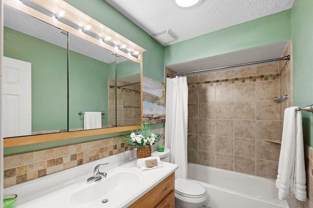 full bathroom featuring backsplash, shower / bath combination with curtain, vanity, toilet, and a textured ceiling