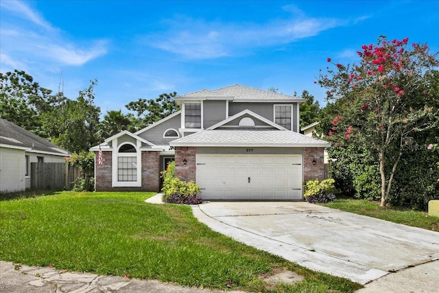 view of front property featuring a garage and a front yard