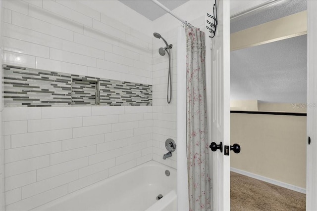 bathroom with shower / bath combination with curtain