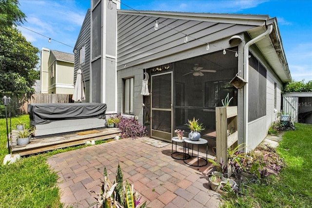 back of property featuring a patio area and ceiling fan