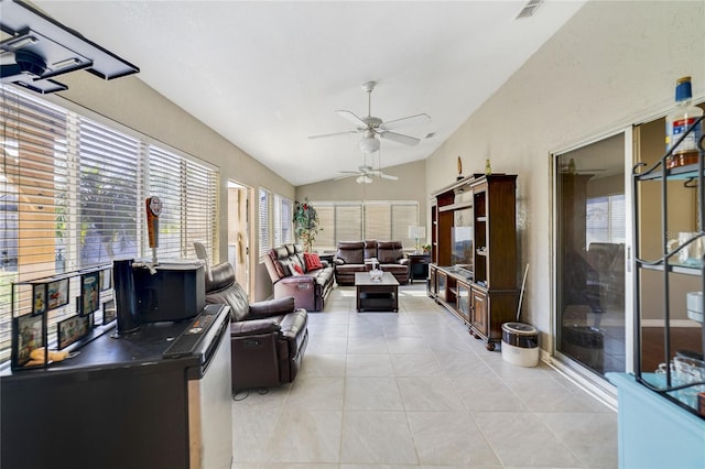 living room with light tile patterned flooring, vaulted ceiling, and ceiling fan