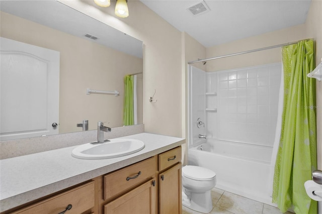 full bath featuring toilet, vanity, visible vents, and tile patterned floors