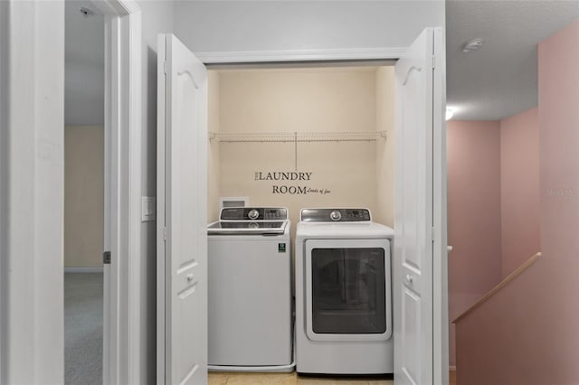 laundry area with laundry area and washer and clothes dryer