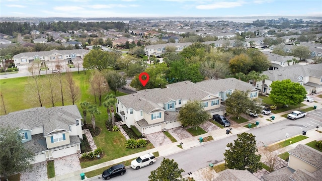 birds eye view of property with a residential view