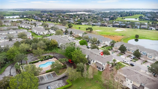 bird's eye view with a residential view and a water view