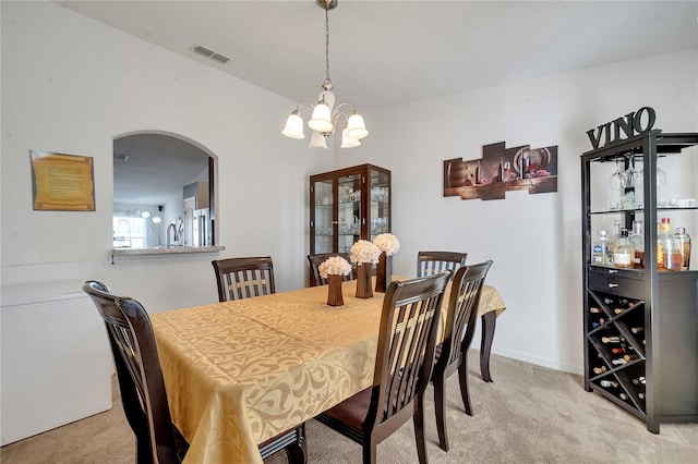 dining room featuring light carpet