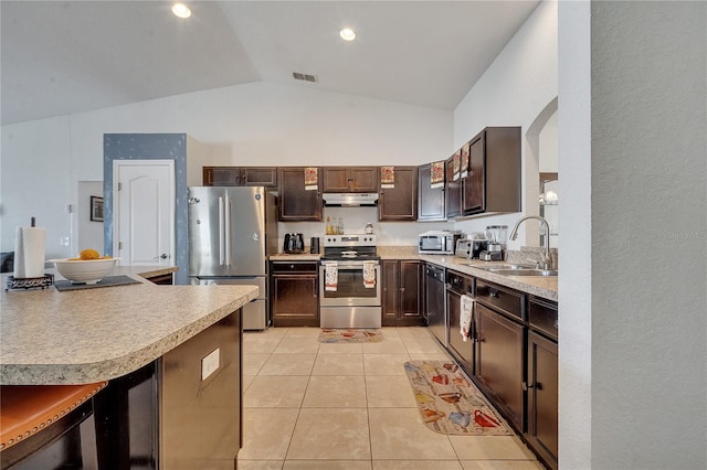 kitchen featuring stainless steel appliances, dark brown cabinetry, vaulted ceiling, light tile patterned floors, and sink