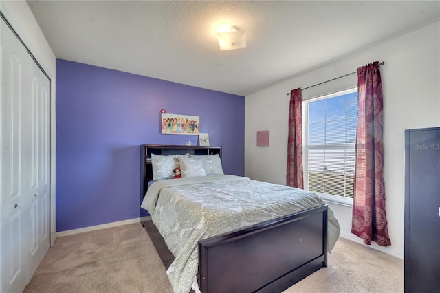 carpeted bedroom with a closet