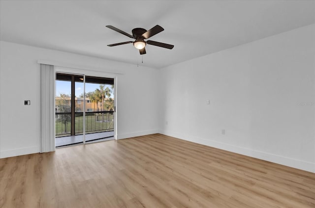 spare room featuring ceiling fan and light hardwood / wood-style floors