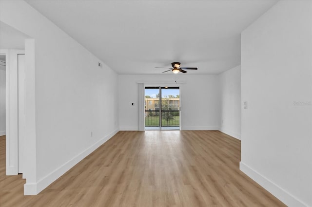 unfurnished room with ceiling fan and light wood-type flooring