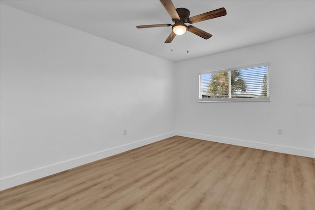 spare room featuring ceiling fan and light wood-type flooring