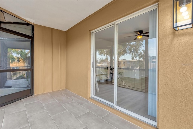 interior space with ceiling fan