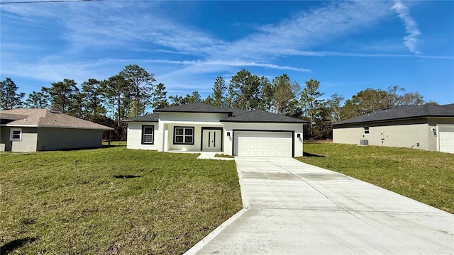 prairie-style house featuring driveway, a front lawn, an attached garage, and stucco siding