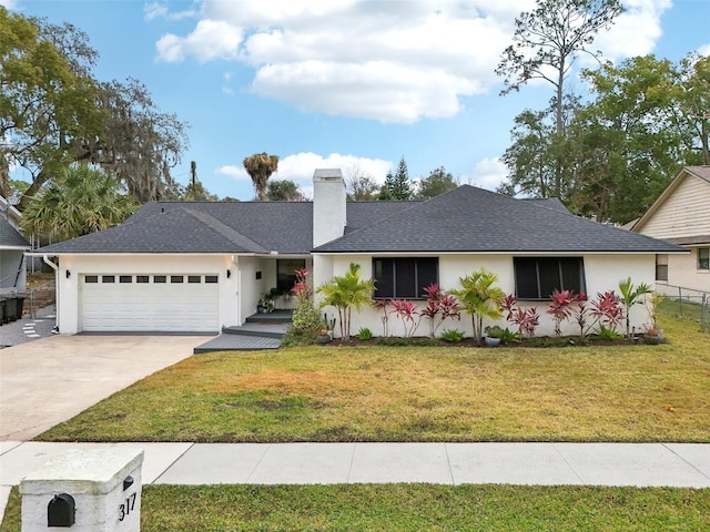 ranch-style home with a garage and a front yard