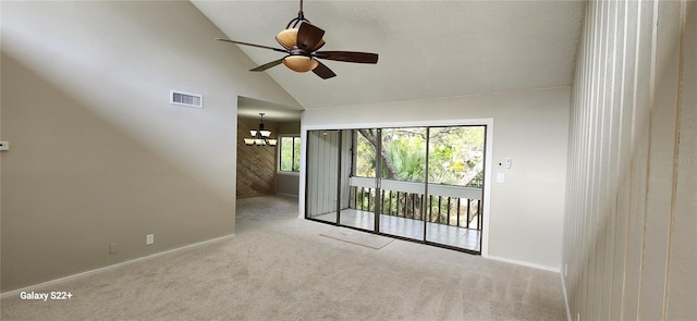 unfurnished room featuring light colored carpet, high vaulted ceiling, and ceiling fan with notable chandelier