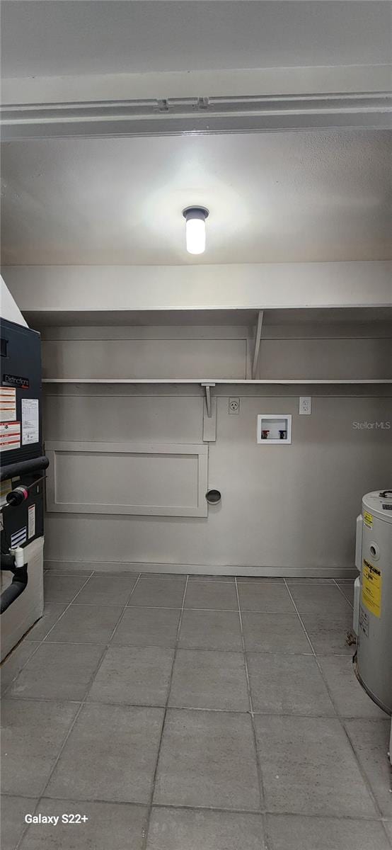 laundry area with washer hookup, water heater, and electric dryer hookup