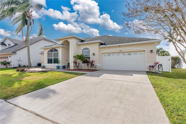 view of front of home featuring a garage and a front yard