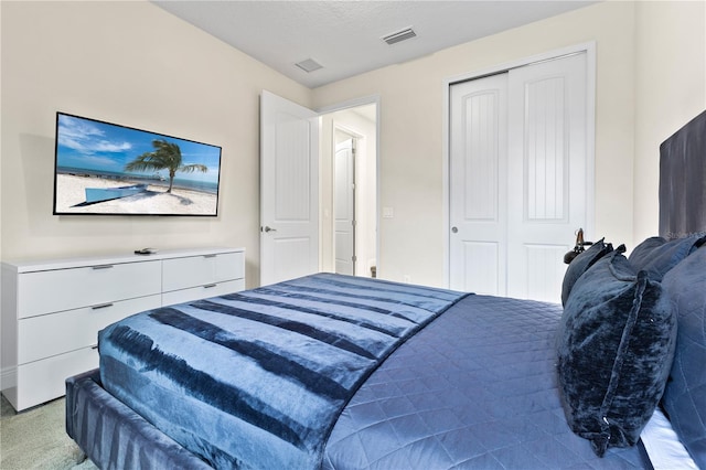 bedroom featuring a closet and a textured ceiling