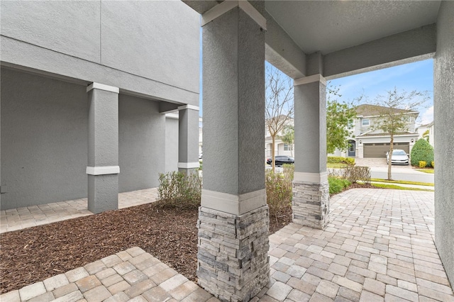 view of patio / terrace featuring a garage