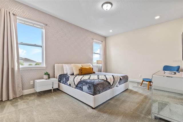 bedroom featuring carpet floors and multiple windows