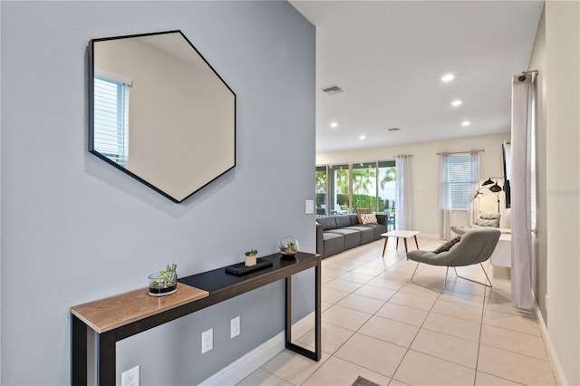 hallway featuring light tile patterned flooring