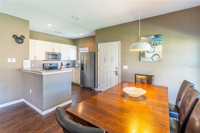 dining room featuring dark hardwood / wood-style floors