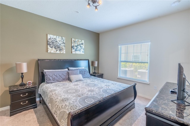 bedroom with light carpet