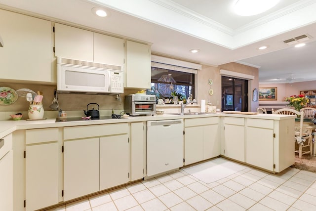 kitchen with sink, crown molding, white appliances, ceiling fan, and cream cabinetry