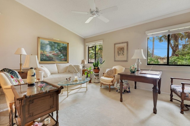 living room with crown molding, ceiling fan, carpet floors, a textured ceiling, and vaulted ceiling