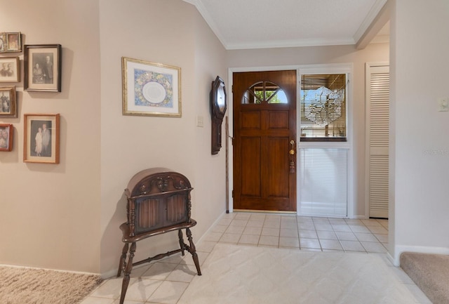 entryway featuring ornamental molding and light tile patterned flooring