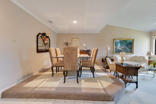 carpeted dining area featuring ornamental molding