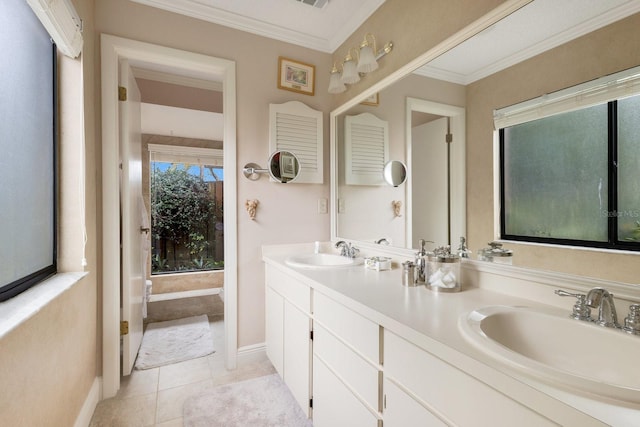 bathroom featuring vanity, crown molding, and tile patterned floors