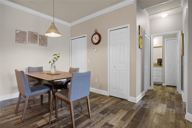 dining space with ornamental molding and dark wood-type flooring