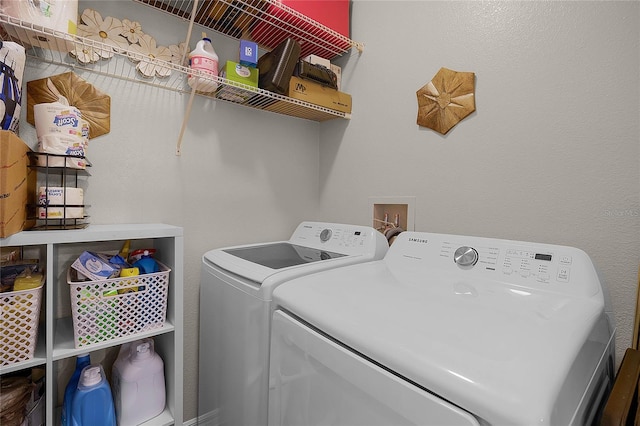 laundry area with washing machine and clothes dryer