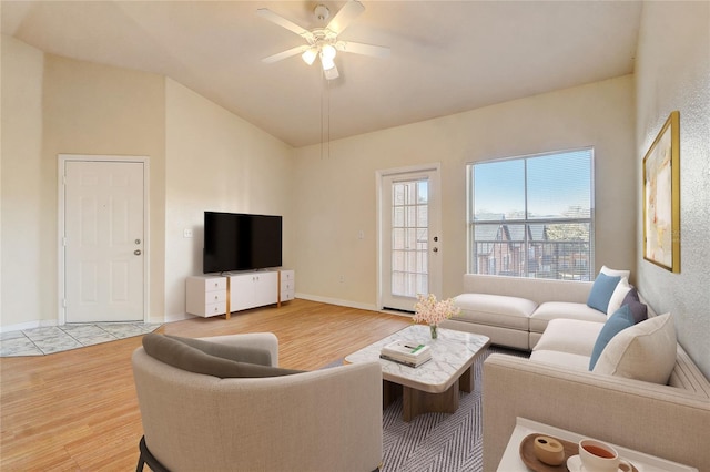 living room featuring ceiling fan, lofted ceiling, and hardwood / wood-style floors