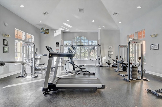 gym featuring a high ceiling