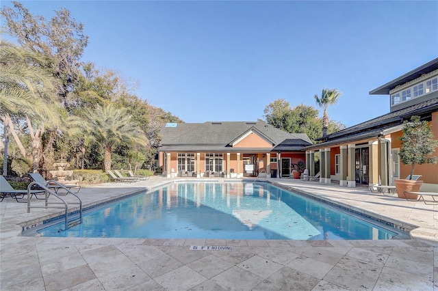 view of swimming pool with a patio area