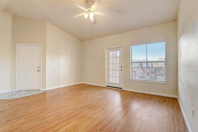 5961 Westgate Dr Unit 2034, Orlando, FL 32835 - spare room with light wood finished floors, a ceiling fan, and lofted ceiling