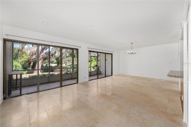 empty room with an inviting chandelier