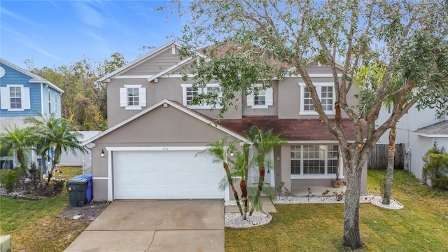 view of front facade with a garage and a front yard