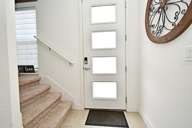 foyer entrance featuring light tile patterned floors