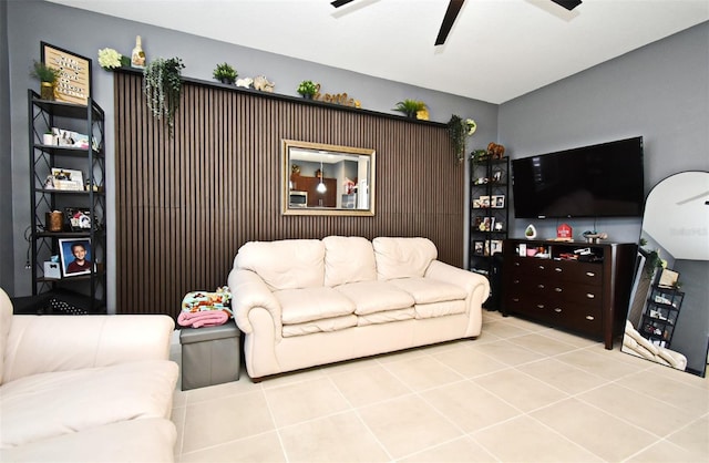 living room with ceiling fan and light tile patterned flooring