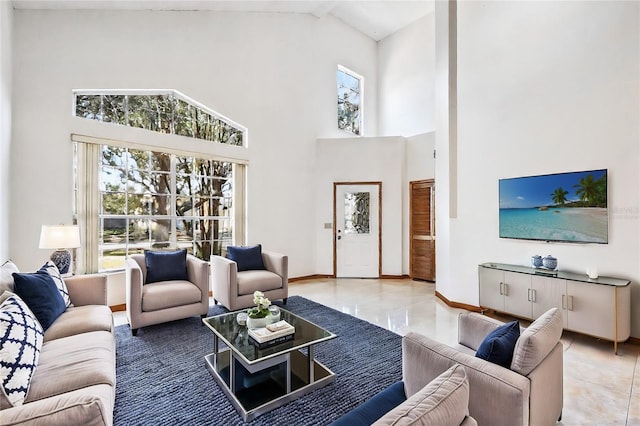 tiled living room featuring high vaulted ceiling