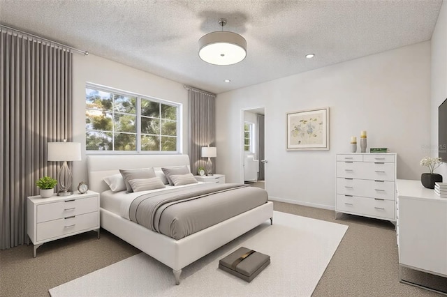 bedroom featuring ceiling fan, dark carpet, and a textured ceiling